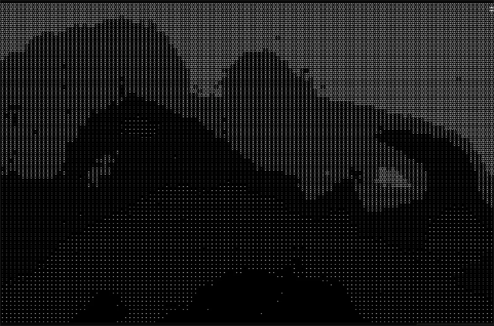 ASCII render of the ink-flower frame: the image rebuilt from tiny glyphs on black.